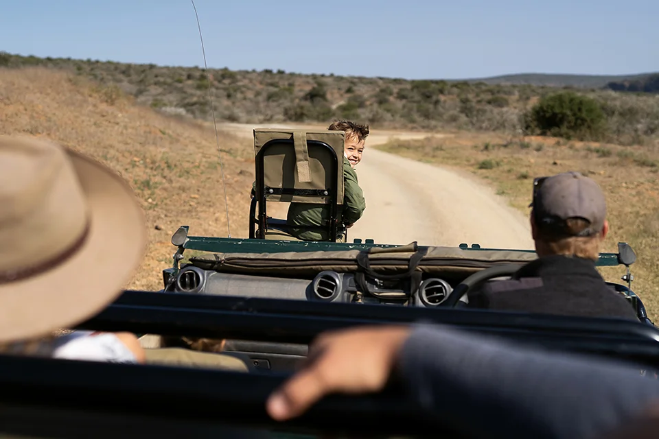 Child enjoying a family game drive at Kwandwe Private Game Reserve, South Africa