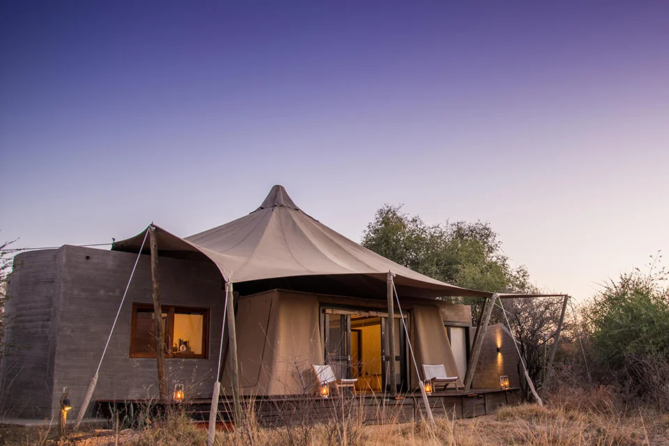 Exterior of a luxury family safari tent with a private deck in the South African bush