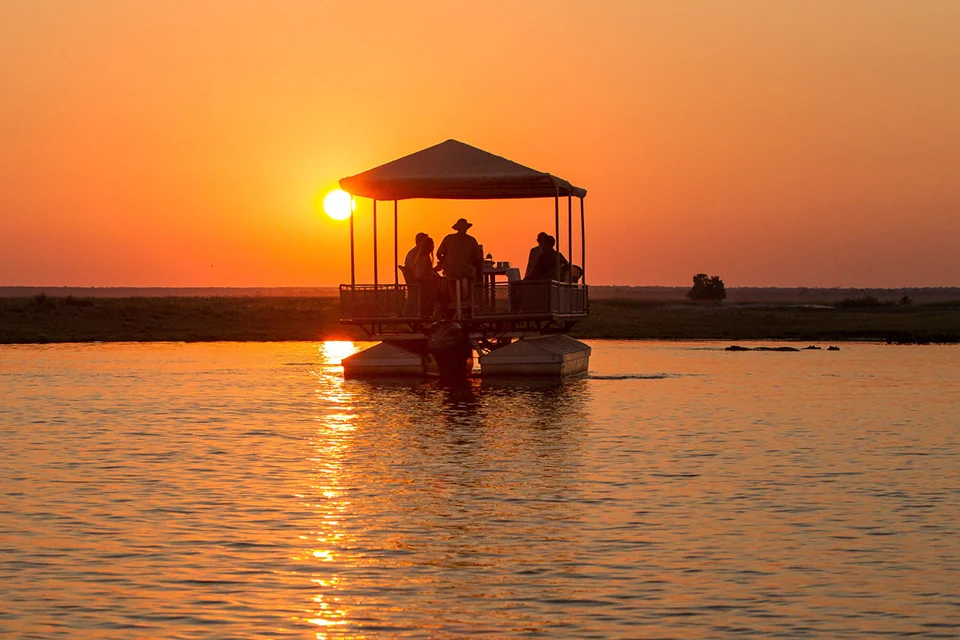Guests enjoying a sunset river safari from Chobe Game Lodge on the Chobe River