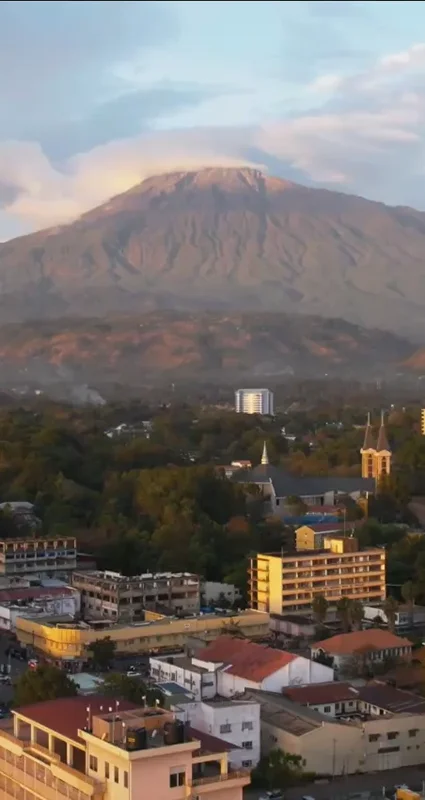 Aerial view of Arusha city with Mount Meru rising in the background, Tanzania