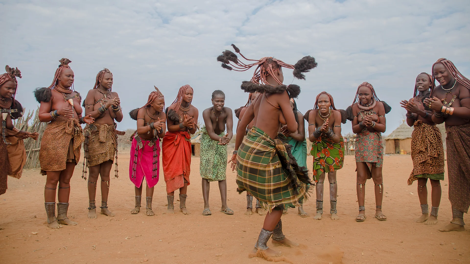 Himba women performing a traditional dance in a village in northern Namibia