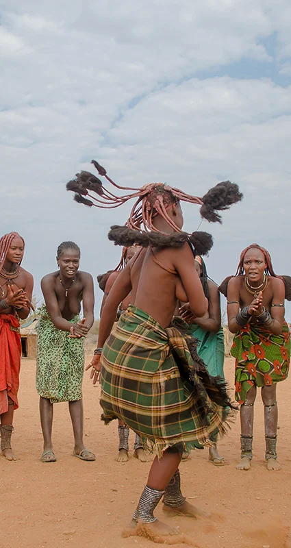 Himba women performing a traditional dance in a village in northern Namibia